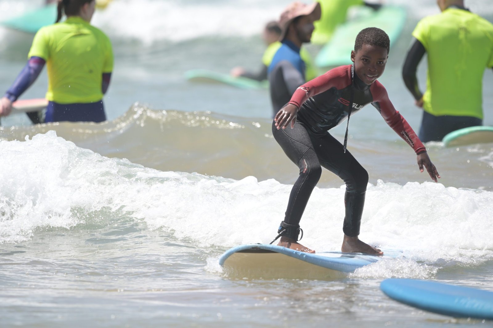 Child catching a wave in Tamraght Morocco