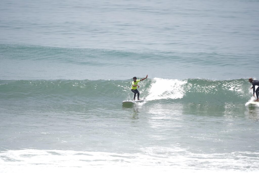 Our surf instructor catching a wave in Tamraght Morocco