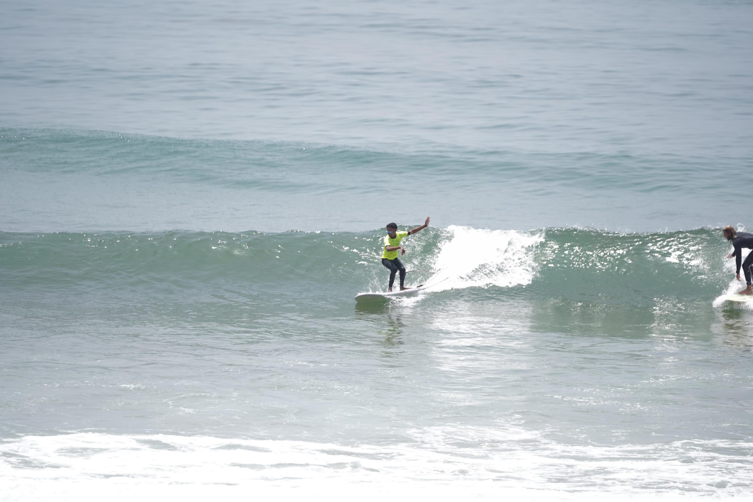 Our surf instructor catching a wave in Tamraght Morocco