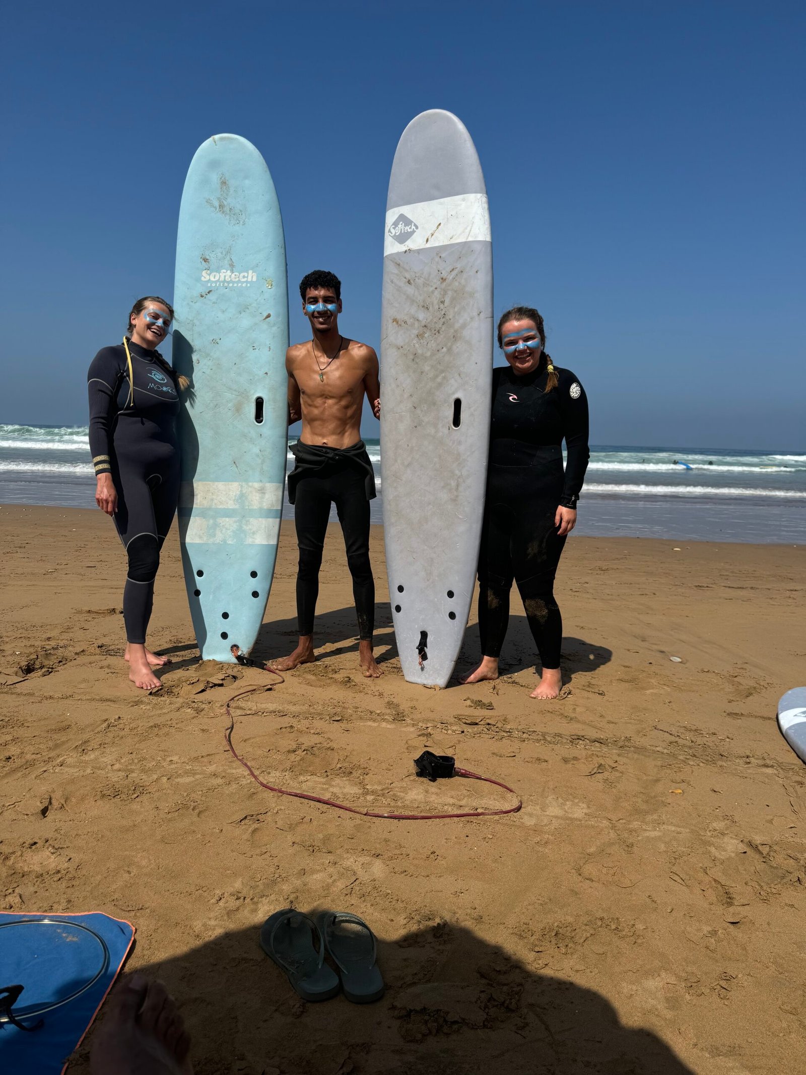 Our surf instructor with two surfers in Tamraght Morocco