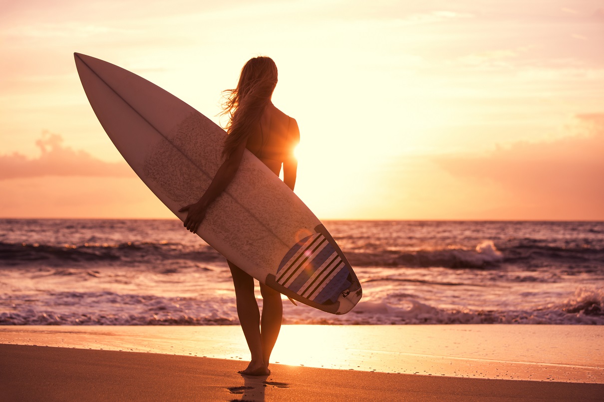 Taghazout Beach surf lesson with beginners catching small waves.