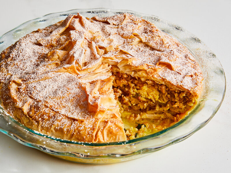 Freshly prepared Moroccan b’stilla pie on a plate