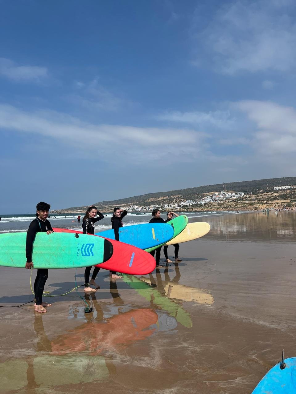 Surfers at PaddleOut Morocco surf camp on the beach in Tamraght, near Agadir